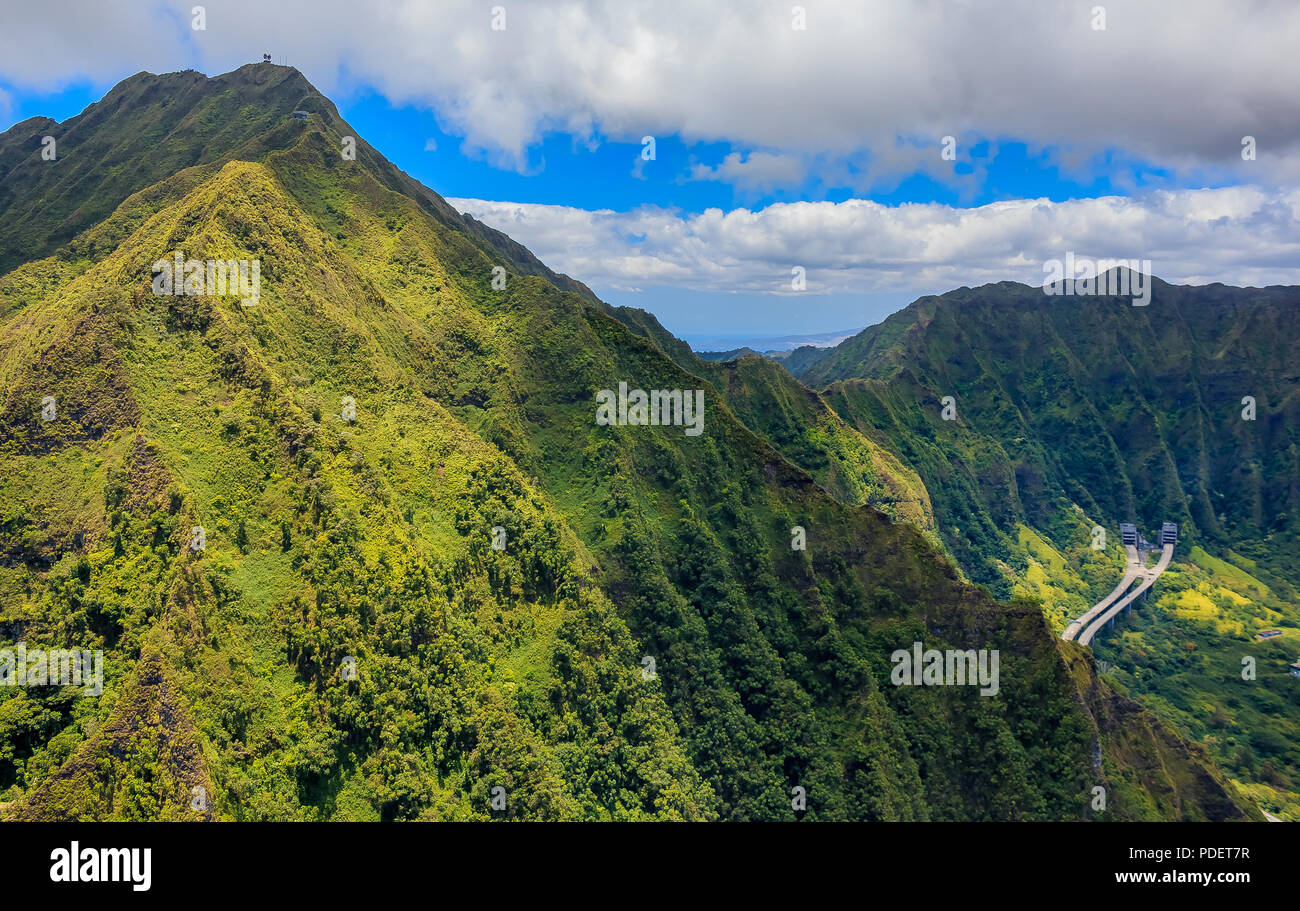 Aerial view mountain ridge line and H-3 freeway and tunnel in Honolulu Hawaii from a helicopter Stock Photo