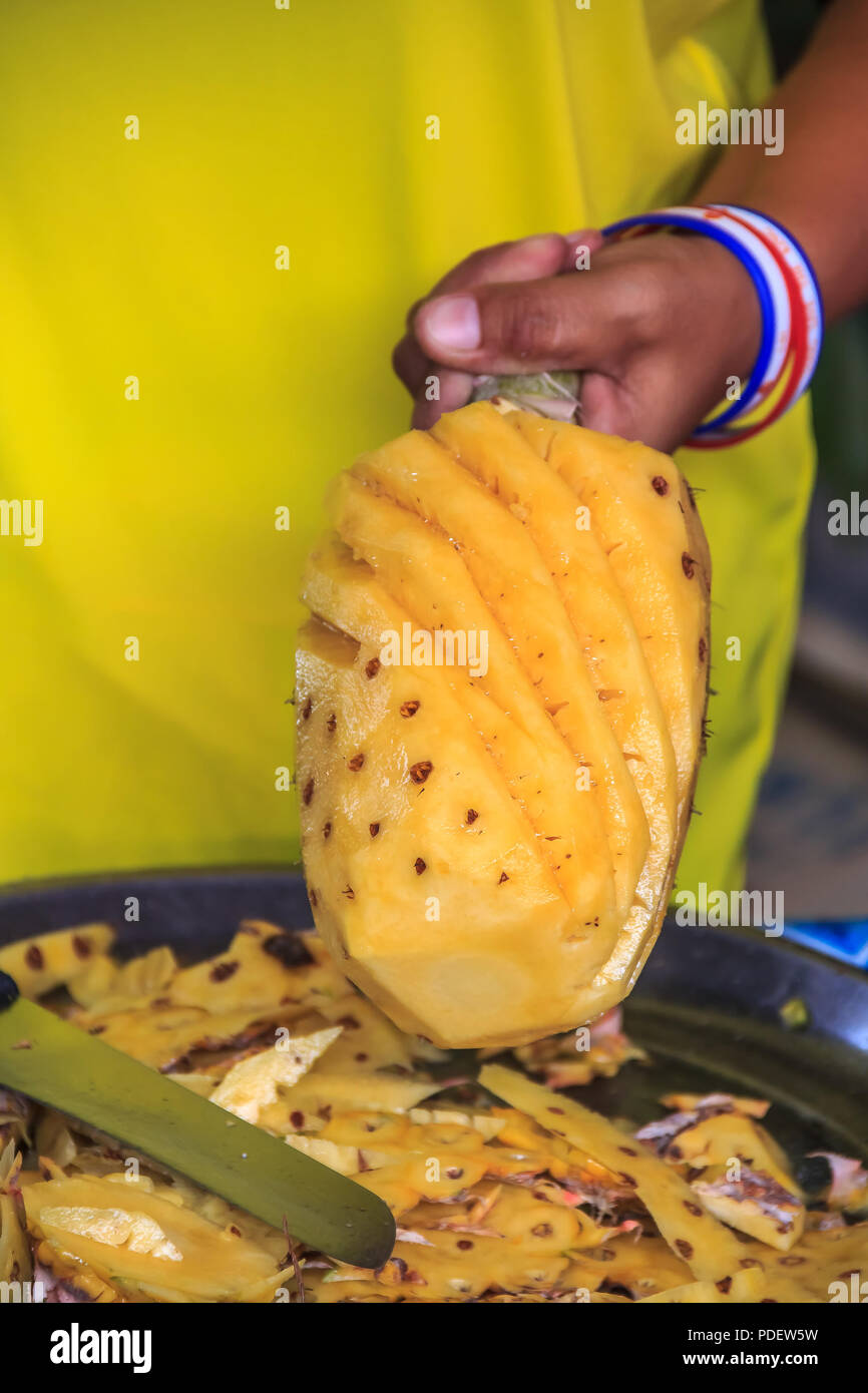Fresh pineapple being sliced at the Market in Krabi Town, Thailand Stock Photo Alamy