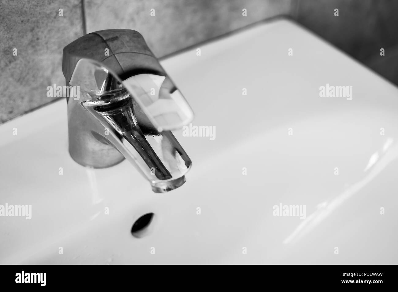 water faucet in the bathroom Stock Photo