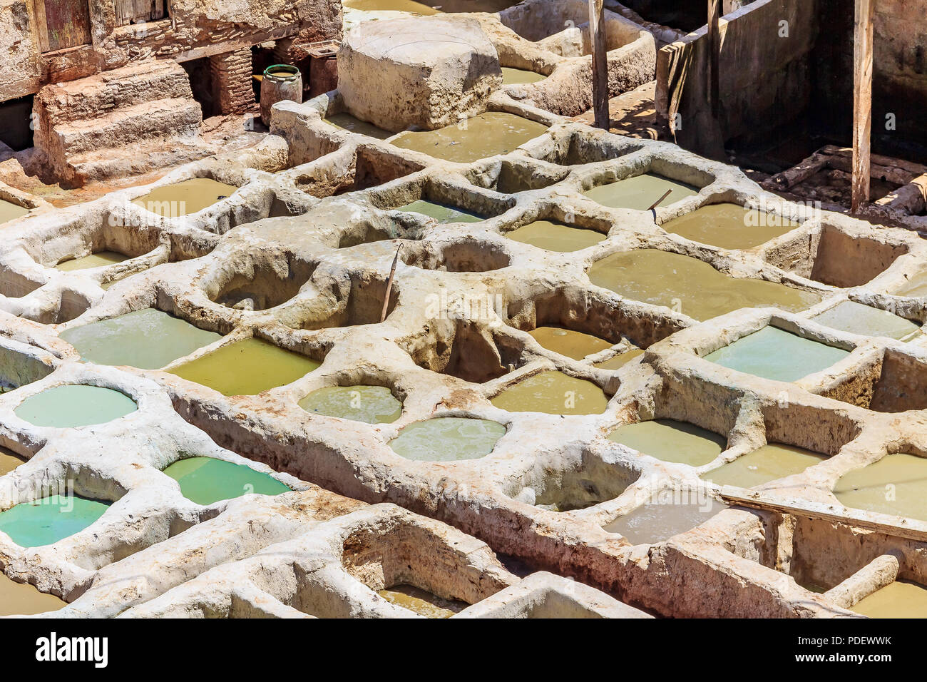 Tannery tanks in Fes, Morocco, filled with tanning solution for leather Stock Photo