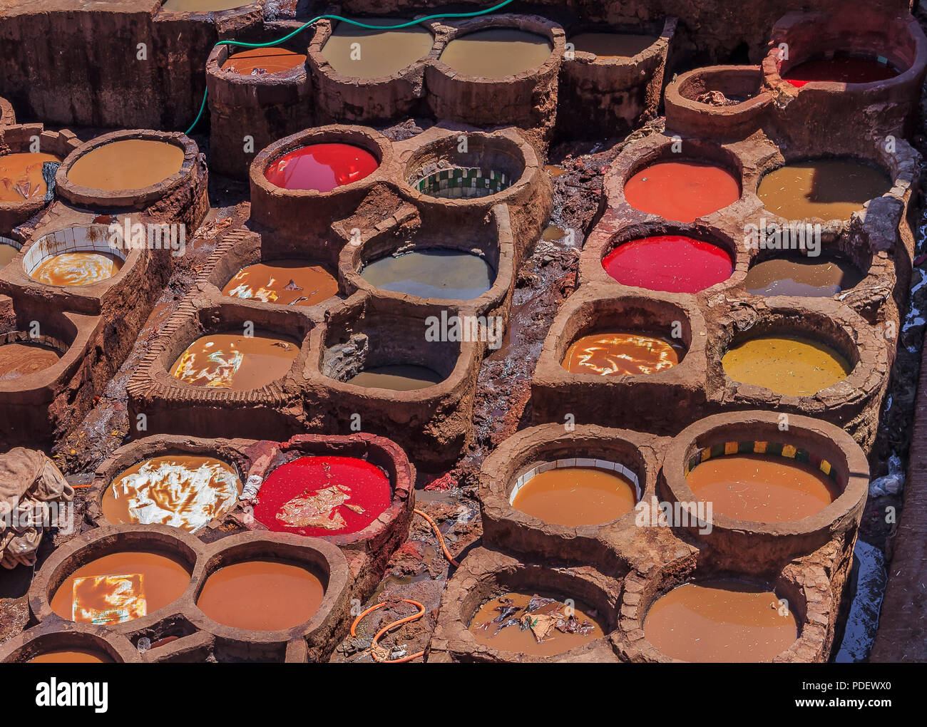 Tannery tanks in Fes, Morocco, filled with dying solution for leather Stock Photo