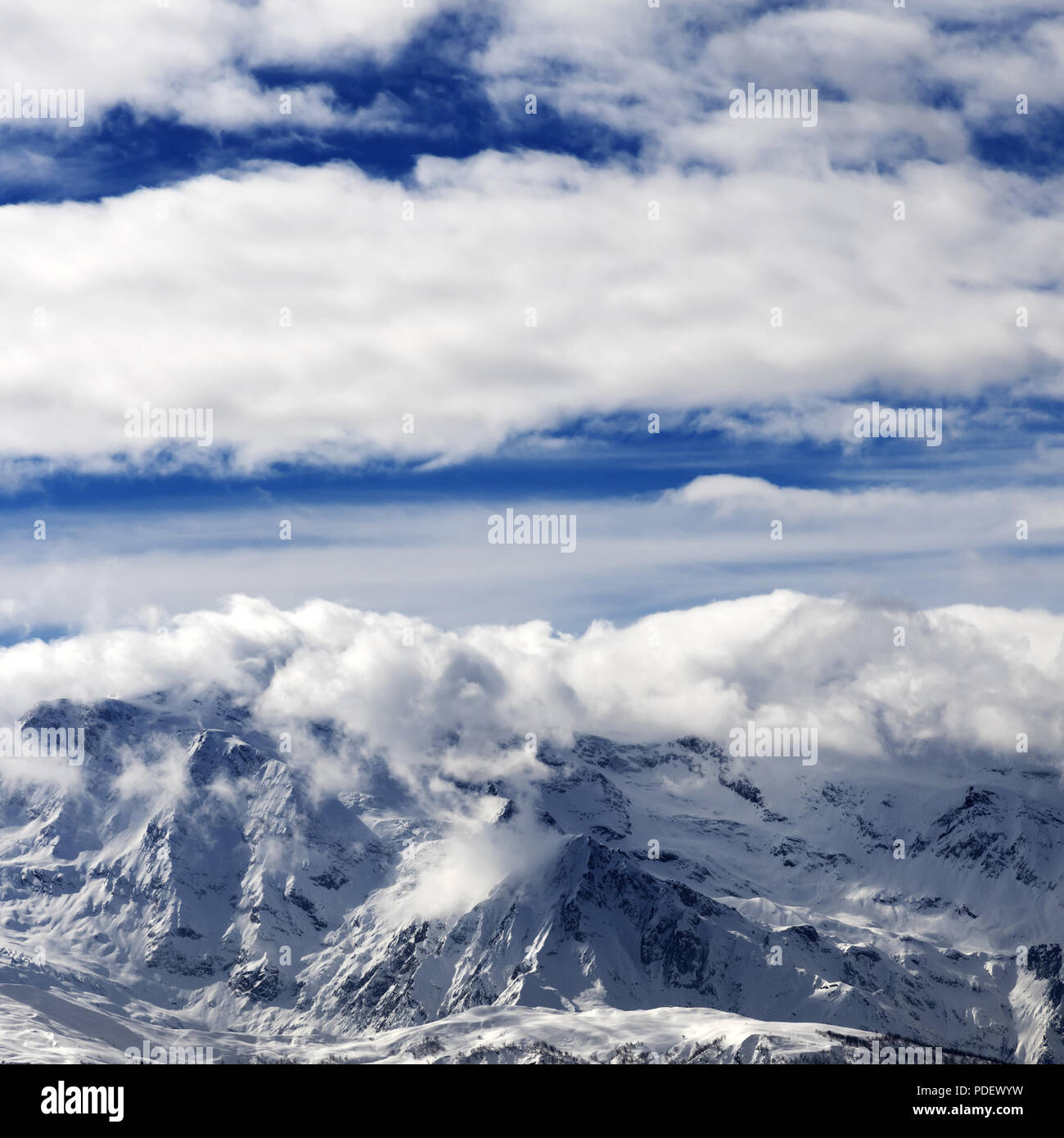 Sunlight snowy mountains in clouds. Caucasus Mountains. Georgia, region ...