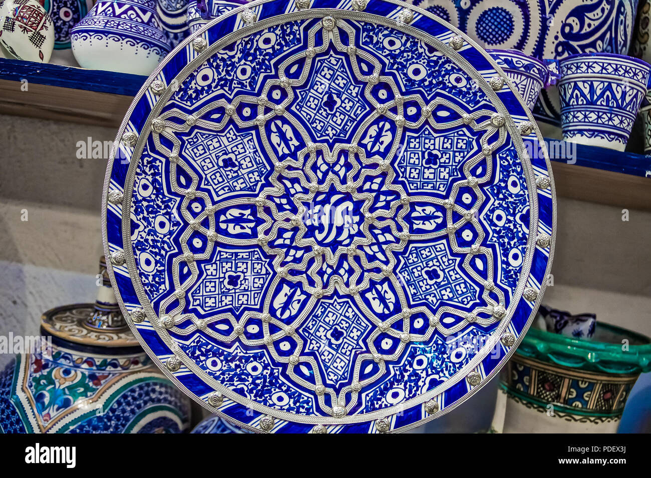 Traditional Moroccan embellished plate decorated with ornate silver