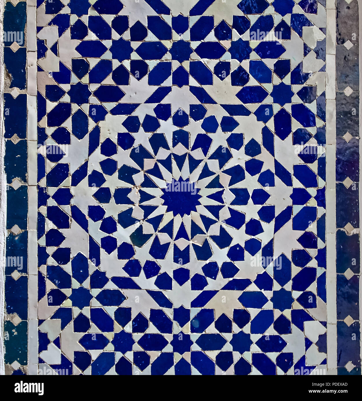 Traditional ornate Moroccan tile pattern in a riad in Morocco Stock Photo