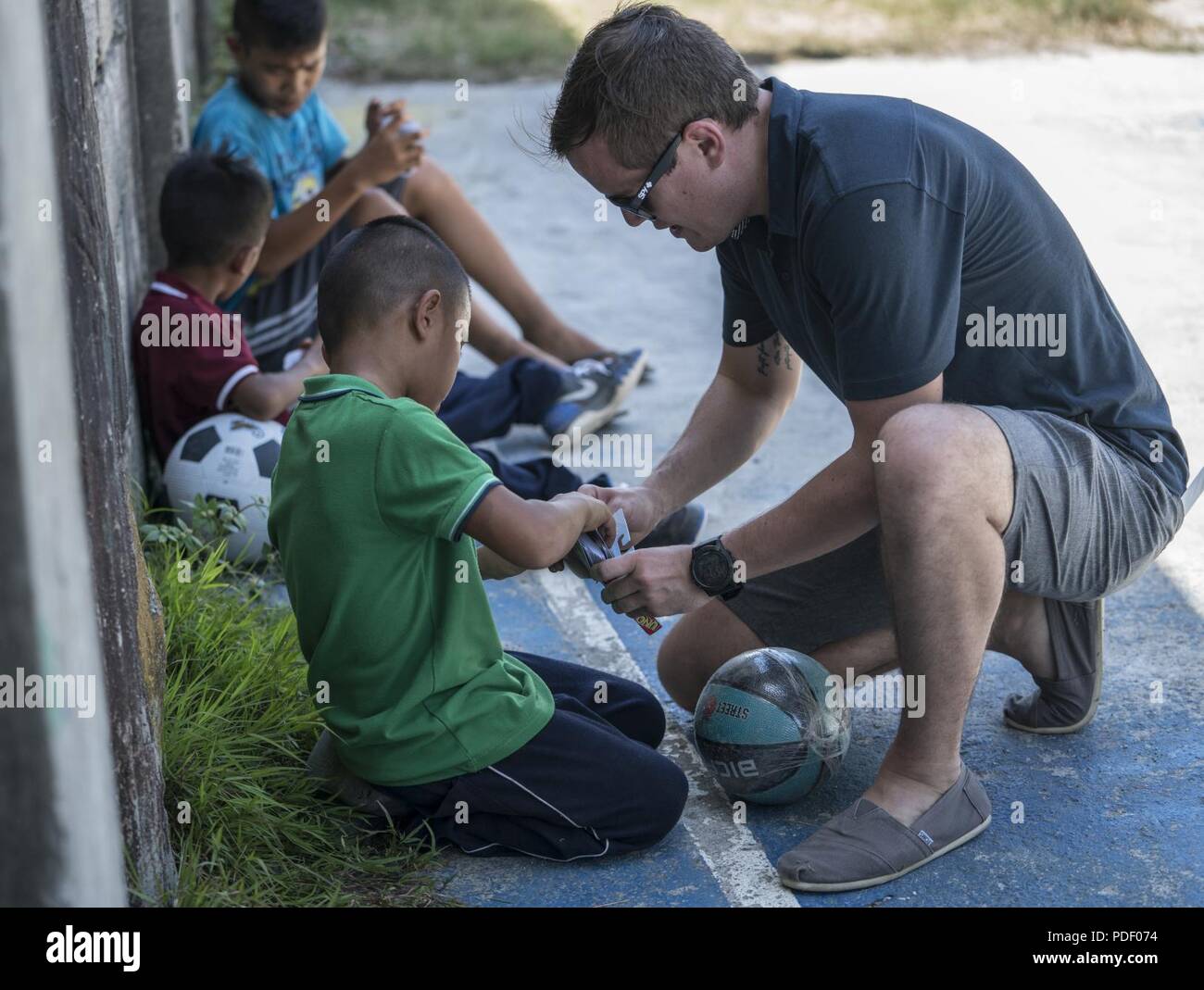 A U S Air Force 353rd Special Operations Group Member Engages With A Philippine Youth From Subic Bay Children S Home During A Community Relations Event May 12 18 At Subic Bay Philippines The