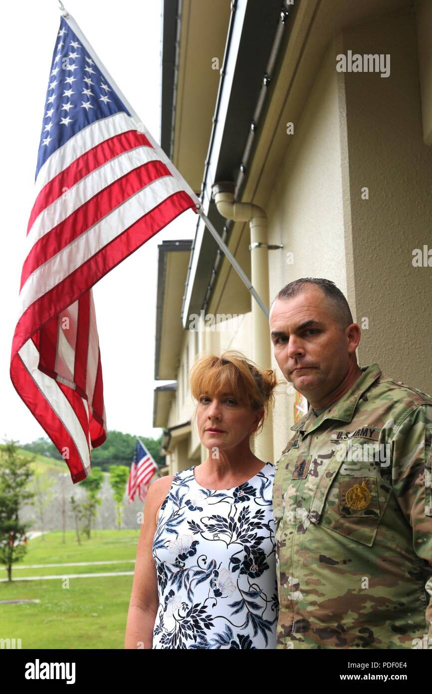 Wendy Holland, left, and Command Sgt. Maj. Will Holland, command sergeant major of U.S. Army Garrison Japan, stand together as parents in front of their home for a Stock Photo