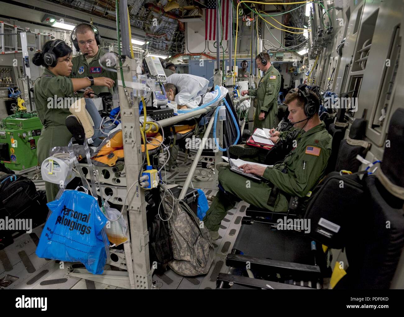 critical-care-air-transport-teams-and-aeromedical-evacuation-teams-provide-medical-care-and-attention-to-patients-onboard-a-c-17-globemaster-iii-from-travis-air-force-base-calif-after-leaving-joint-base-pearl-harbor-hickam-hawaii-may-18-2018-the-c-17-was-configured-by-an-ae-aircrew-to-provide-aerial-transport-of-patients-throughout-the-pacific-region-PDF0KD.jpg
