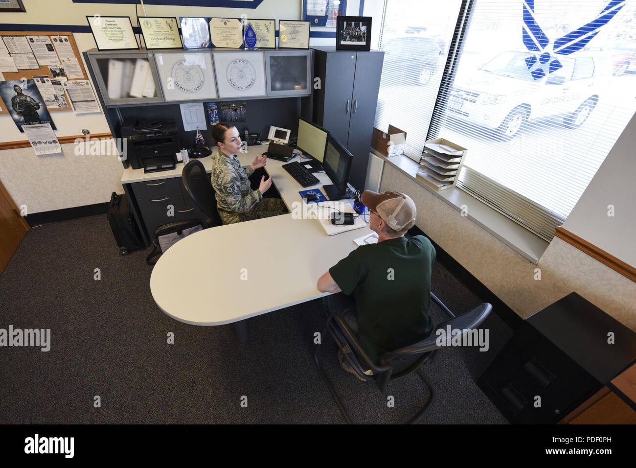 Air Force Tech. Sgt. Kimberly Reeser, recruiter located in Grand Forks,  North Dakota, assists recruit with the transition into the military here.  Reeser is currently the only recruiter in the Grand Forks