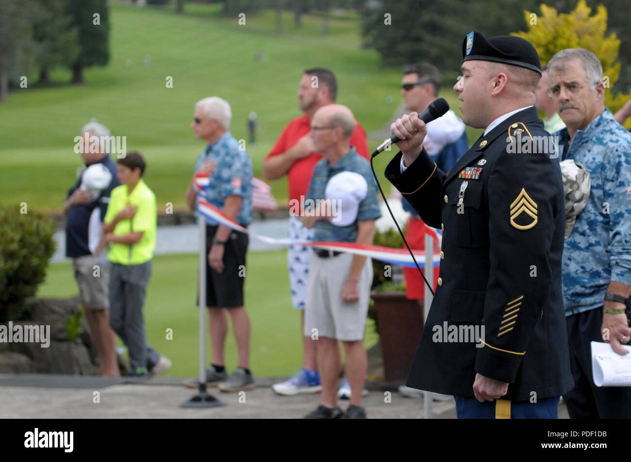 Ssg. James Hosat, from the I Corps Band on Joint Base Lewis-McChord, performs the National Anthem during the opening ceremony of the Muckleshoot Casino Washington Open Pro-Am May 19 at the Meridian Valley Country Club in Kent, Washington. The event took place over Armed Forces Weekend. Stock Photo