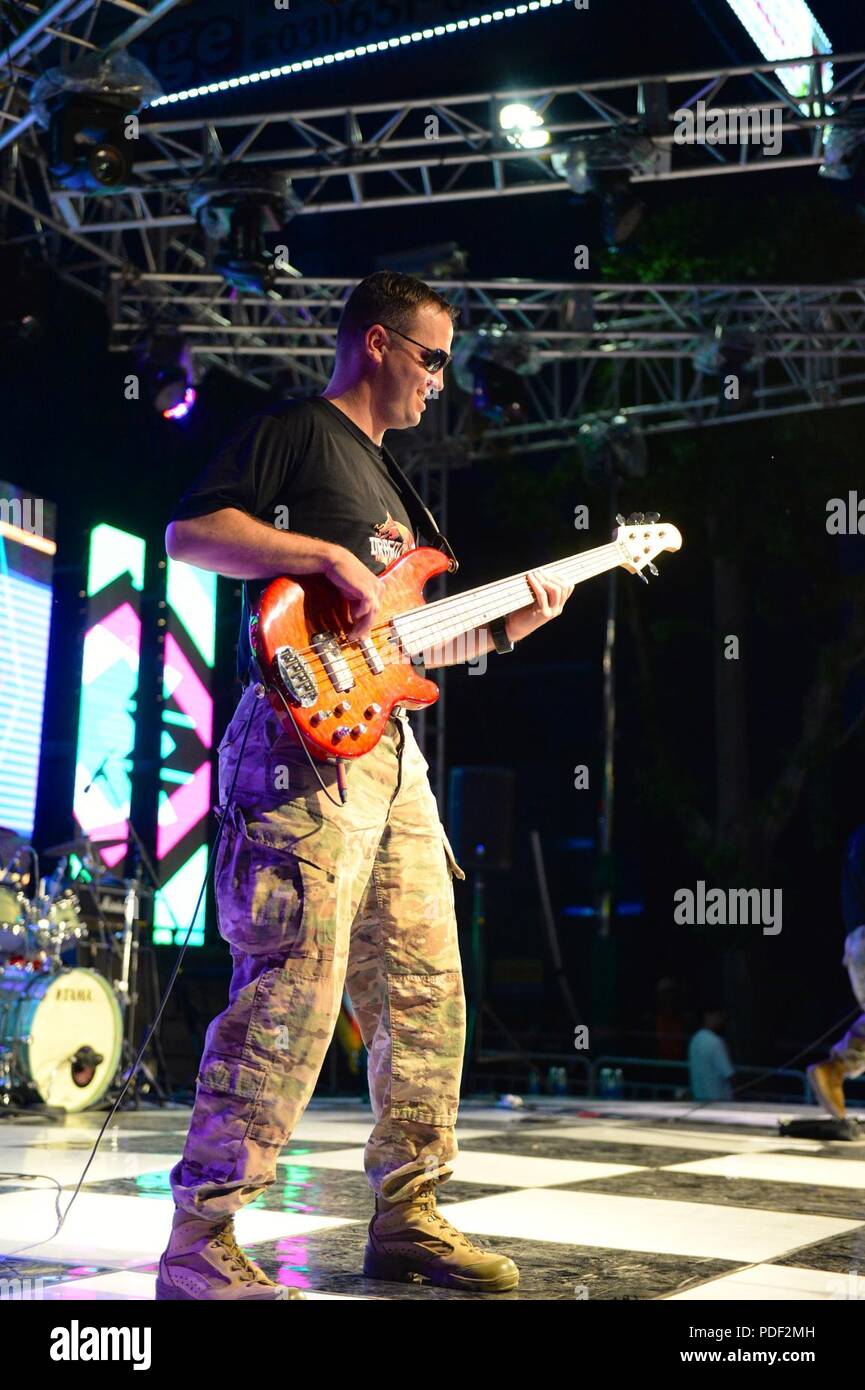 Sgt. Stephen Adkisson, a guitarist for the Eighth Army Band, rocks the crowd May 20 outside USAG Humphreys drive-in gate in Pyeongtaek, South Korea during the 2018 Spring Festival. The Spring Festival for 2018 was held both on and off USAG Humphreys, the off base portion was put together by the city of Pyeongtaek and had a flea market, games, food and a stage for multiple musical performances by both local bands and the U.S. Army. Stock Photo