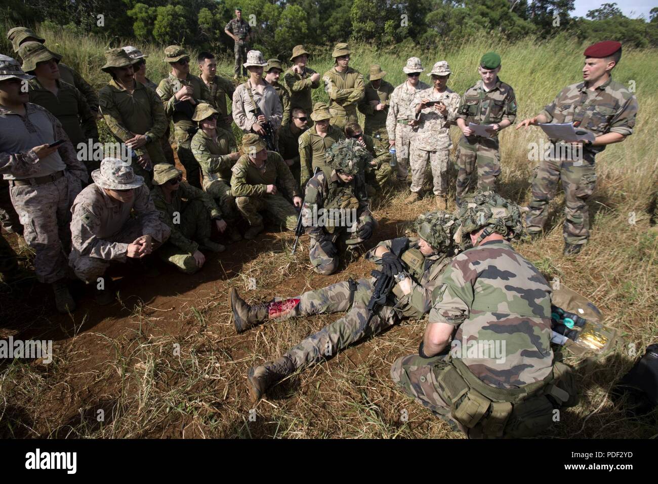 U.S. Marines, Sailors, Australian Defence Force and French Armed Forces personnel conduct a Casualty Evacuation scenario during exercise Croix Du Sud at Plum, New Caledonia, May 14, 2018. The exercise, hosted by the French, is a multi-national humanitarian assistance and disaster relief, a non-combatant evacuation operation and a stability and security operations field training exercise. The Marines are a part of Marine Rotational Force - Darwin, established by former U.S. President Barack Obama and former Australian Prime Minister Julia Gillard in 2011 to build and strengthen partnerships in  Stock Photo