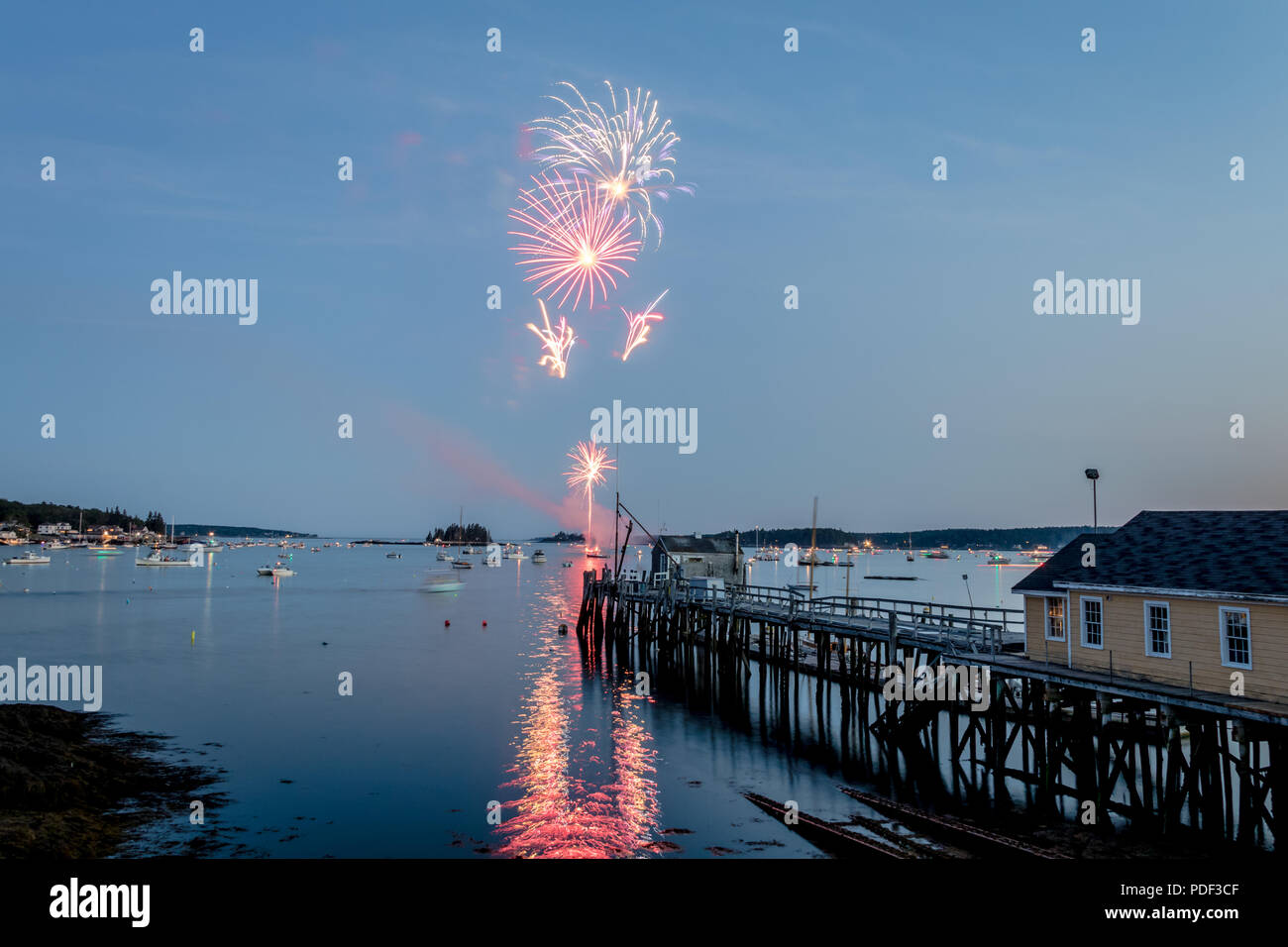 Fireworks on Boothbay Harbor, Maine, reflect off the water on July 4th