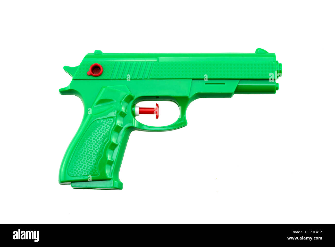 green plastic water toy gun shaped like a real one on white background Stock Photo