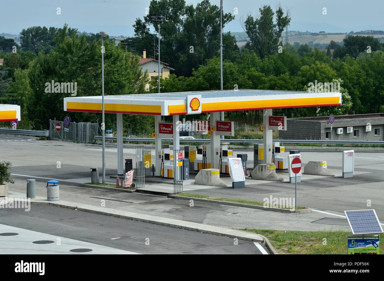 A view of typical Self Service SHELL petrol Pump / Gas Station / with out anybody for filling gas, near highway, Pisa, Italy, Europe Stock Photo