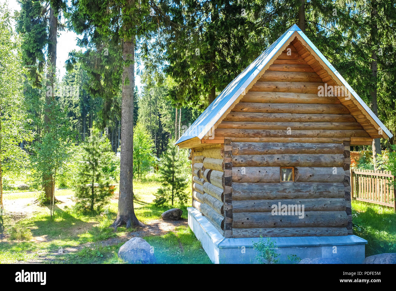 Country house with Windows made of laminated veneer lumber. Warm summer