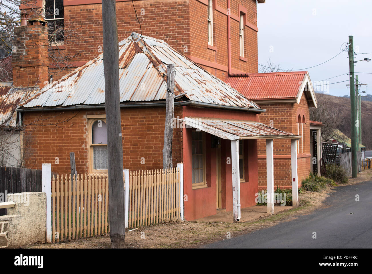 Denison Street Sofala, a small brick cottage and the two storey Post Office for the once thriving gold mining town. the Post Office was built in 1879 Stock Photo