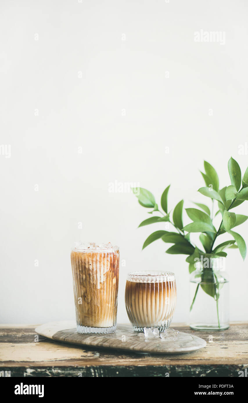 Iced coffee drink in tall glasses with milk, copy space Stock Photo