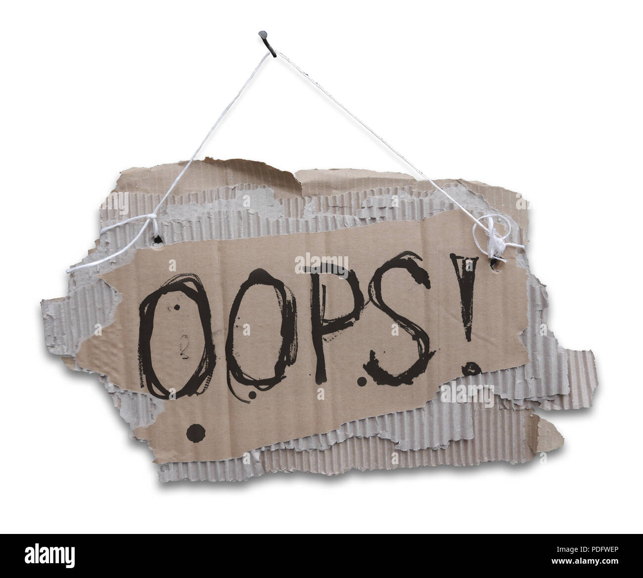 Cardboard sign on a cord with a words OOPS.  Ripped, corrugated paper hanging on cord with white sign OOPS.Isolated on white background. Stock Photo