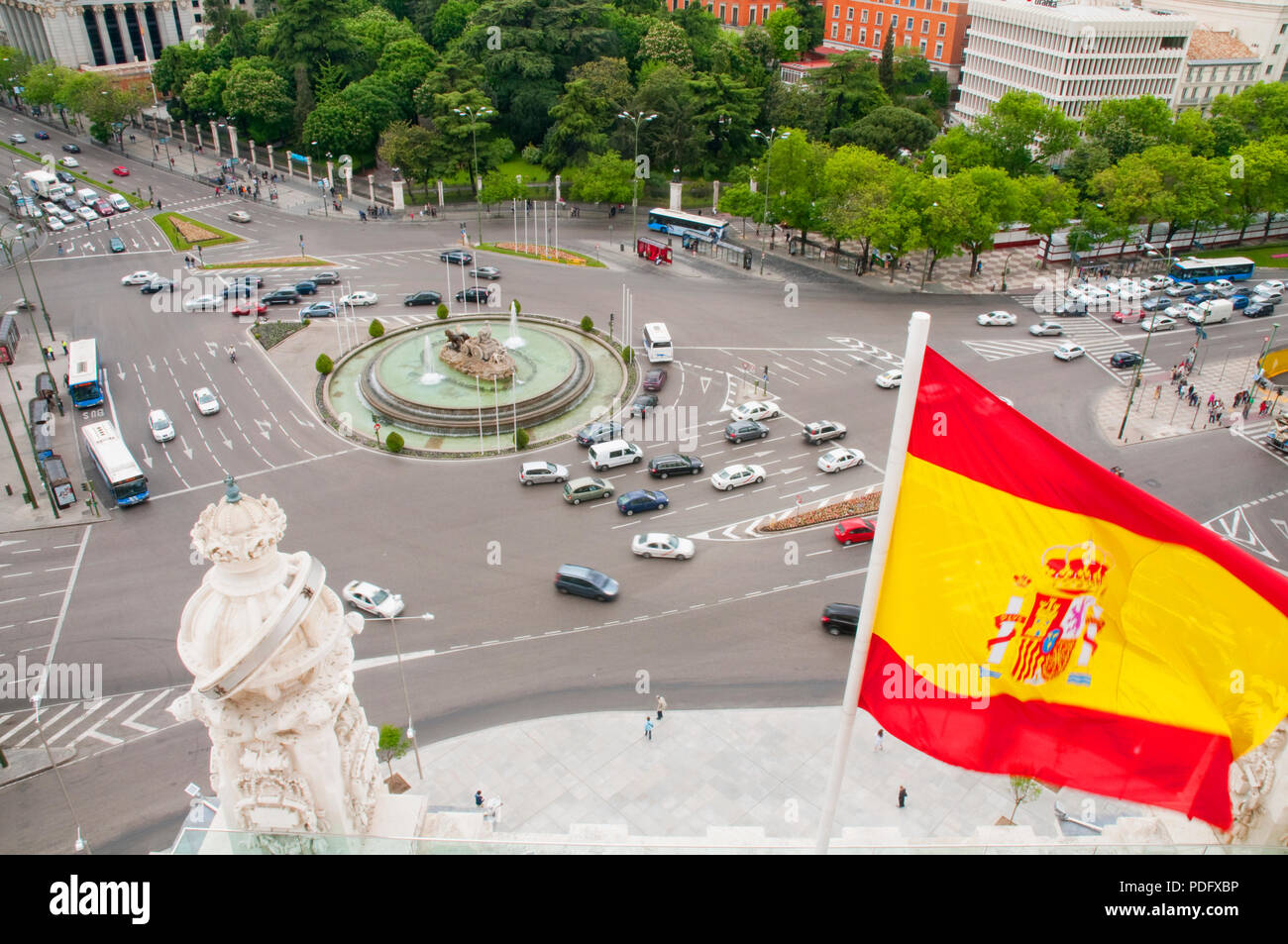 Plaza de la Cibeles and Spanish flag waving, view from the City hall. Madrid, Spain. Stock Photo
