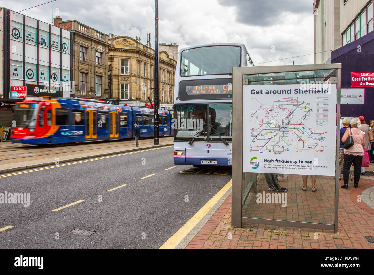 Bus, bus stop, buses and trams 'Get around Sheffield' city centre transport, UK Stock Photo