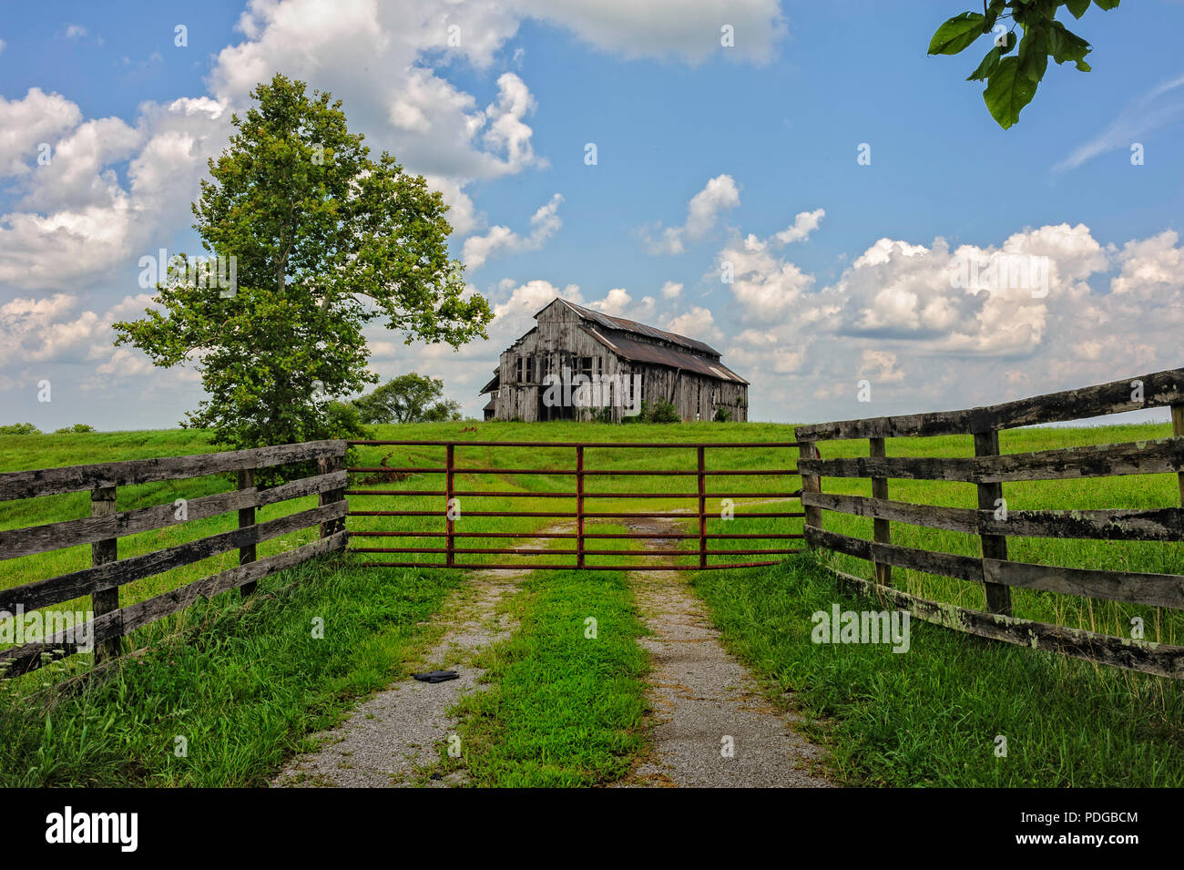 Old Barn with an entrance gate Stock Photo - Alamy