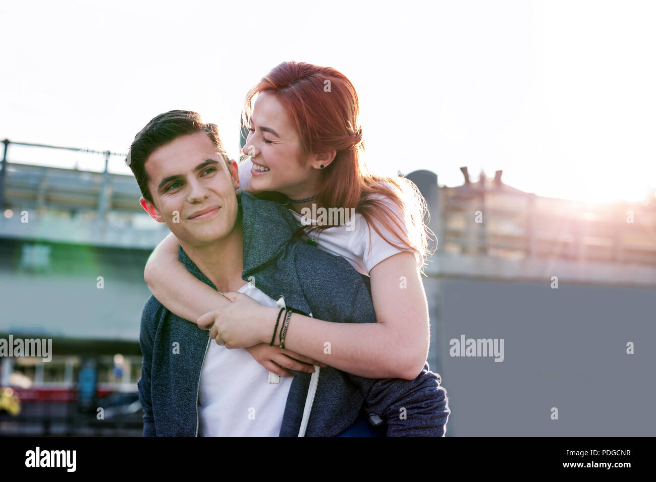 Pretty young woman hugging her boyfriend Sweet memories Stock Photo - Alamy