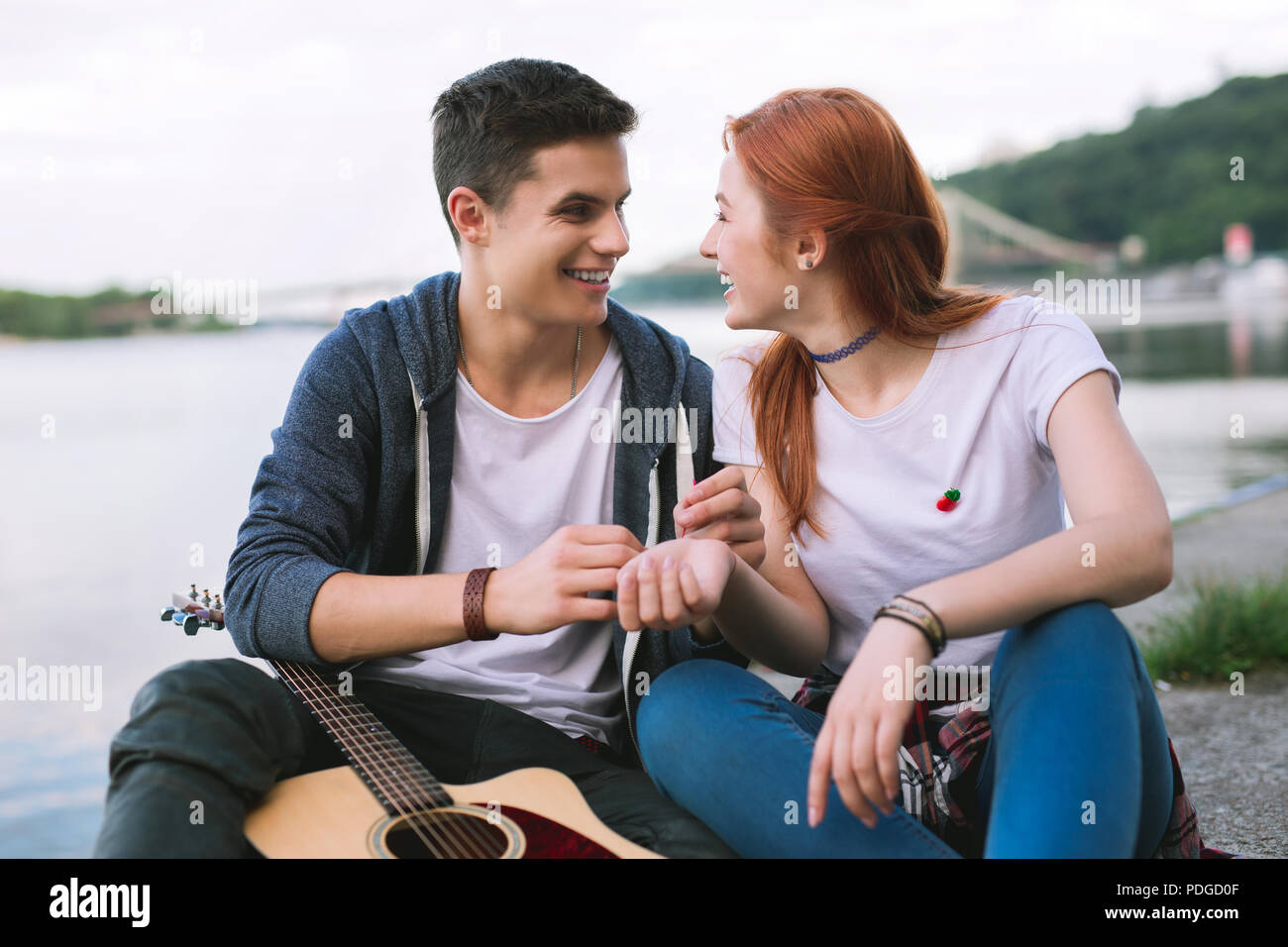 Pleasant cheerful people looking at each other Stock Photo