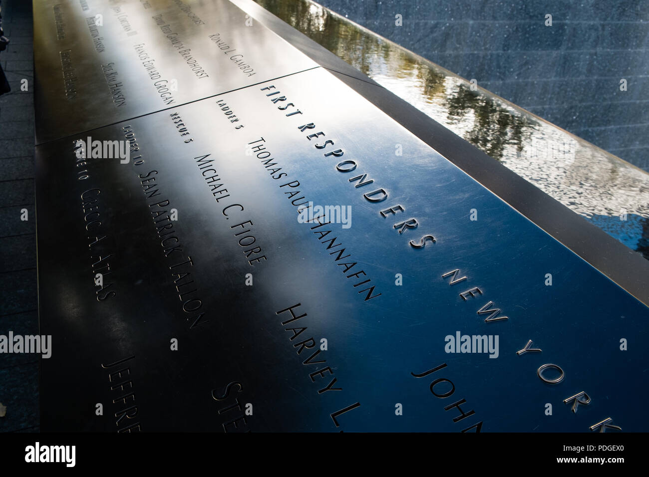 Reflections on a panel of the 9/11 memorial 3 Stock Photo