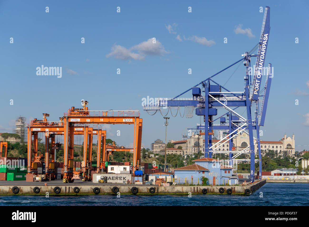 Haydarpaşa port scene in Istanbul Kadıköy with cranes which seem ready for new loadings and ships. Stock Photo