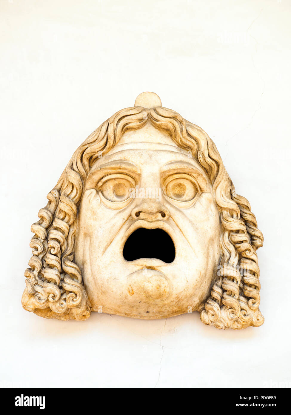 Comic mask in white marble - National Roman Museum - The Baths of Diocletian - Rome, Italy Stock Photo