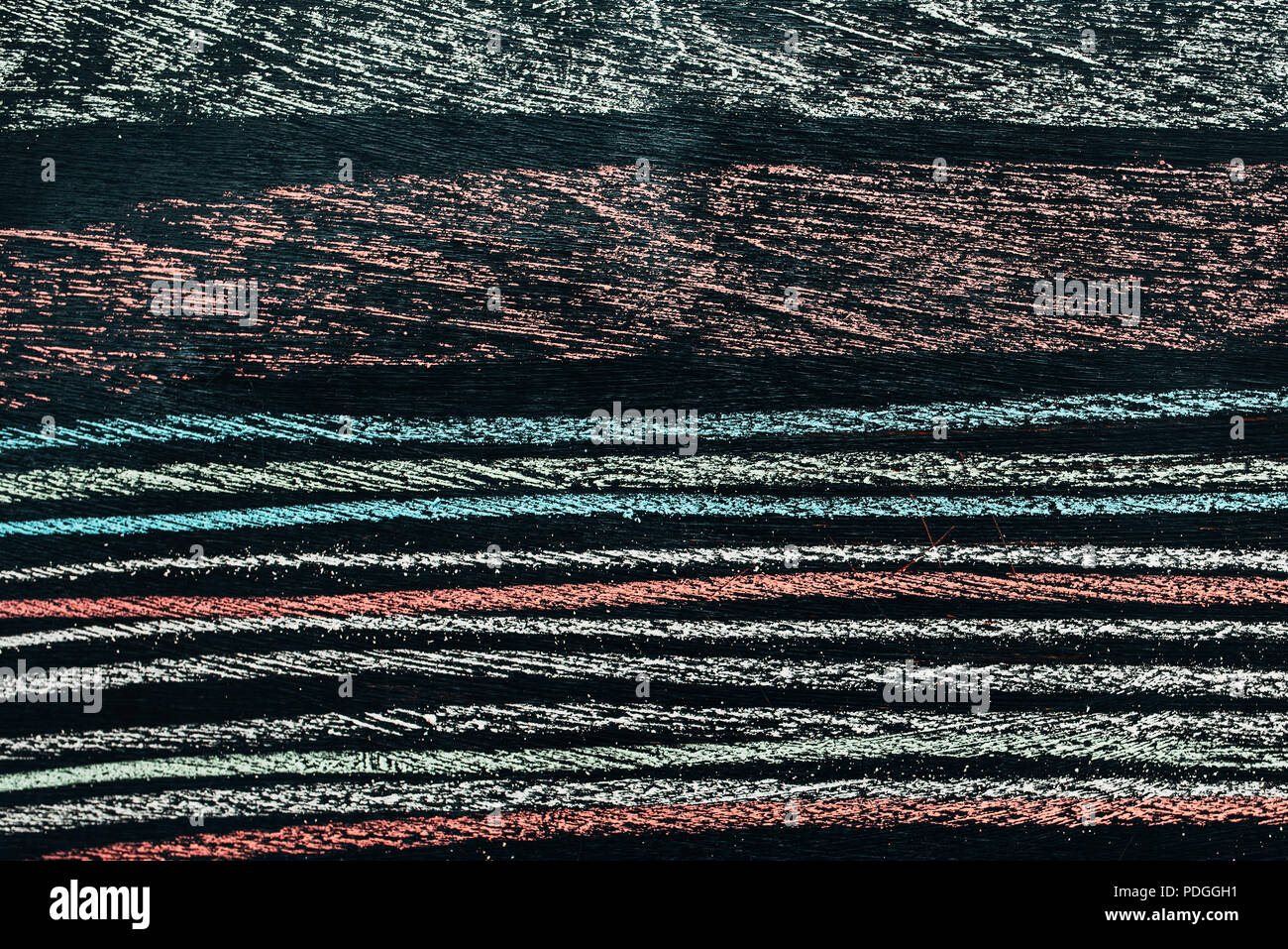Colorful chalk striped pattern on school blackboard, close up of abstract grunge texture Stock Photo