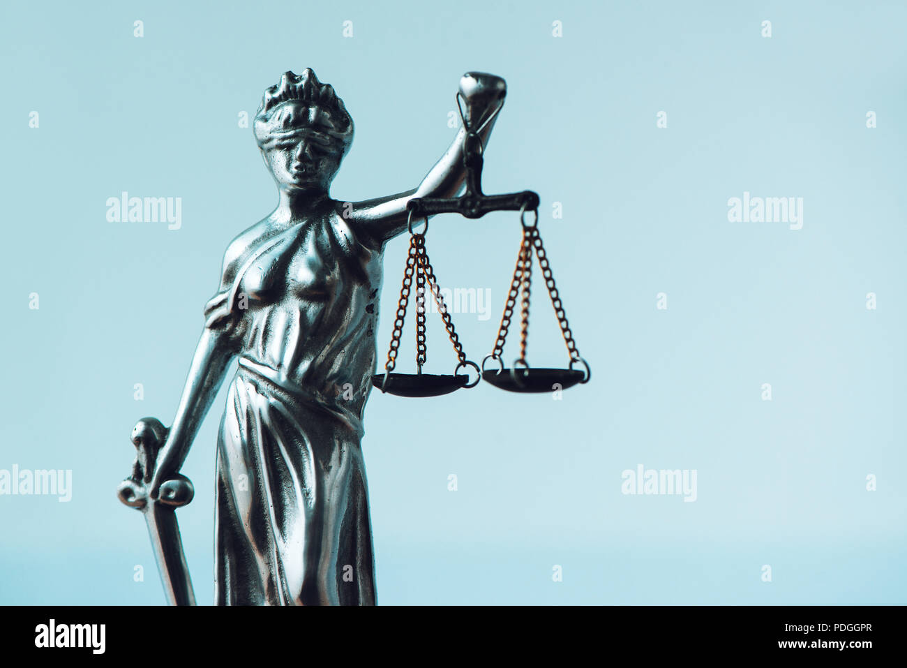 Lady Justice statue in law office. Figurine with blindfold, balance and  sword is personification of moral force in judicial system and it's origin  is Stock Photo - Alamy