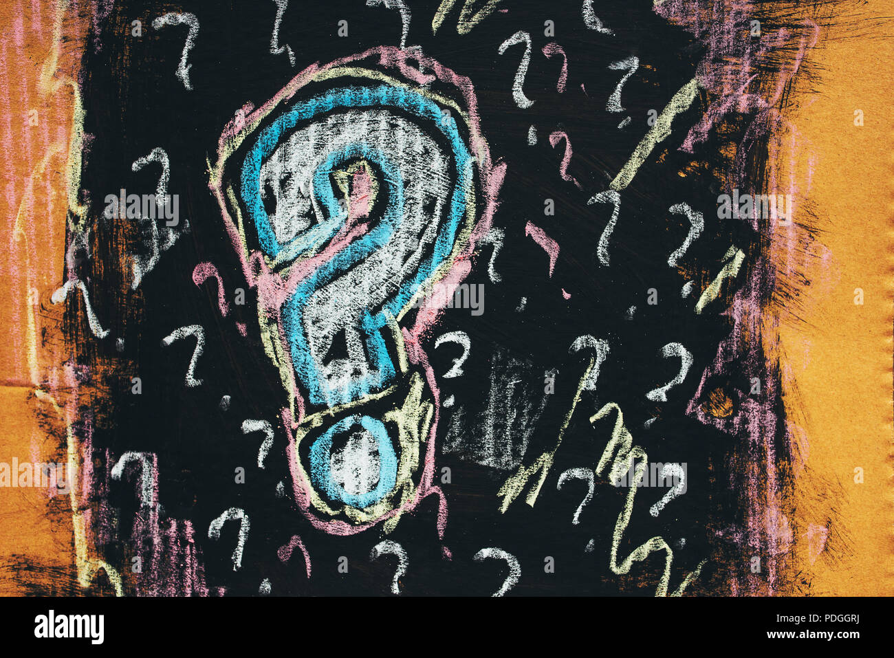 Sketched colorful question mark on cardboard paper, concept of perplex and confusion Stock Photo