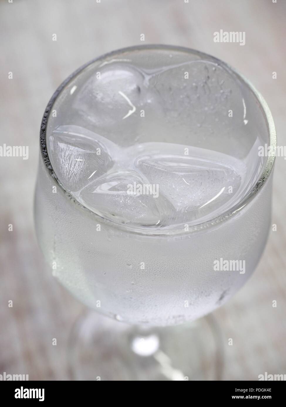 Ice water in a glass cup Stock Photo - Alamy