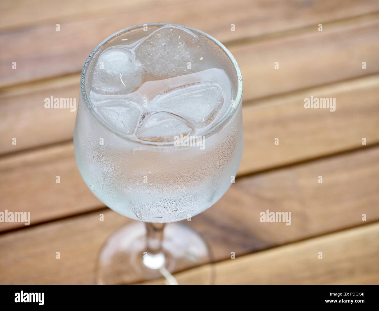 Ice water in a glass cup Stock Photo - Alamy