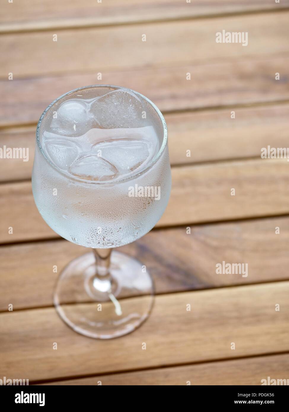Ice water in a glass cup Stock Photo - Alamy