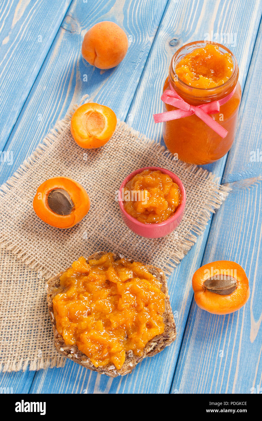 Sandwich with apricot jam or marmalade and ripe fruits, concept of healthy sweet dessert Stock Photo