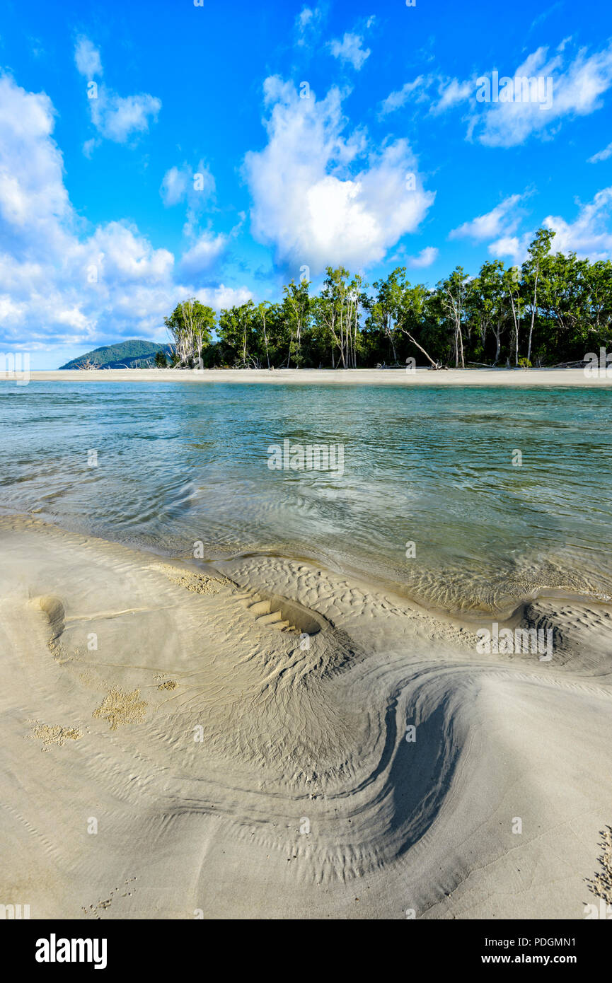 Scenic view of Thornton Beach with sand patterns at low tide, Daintree National Park, Cape