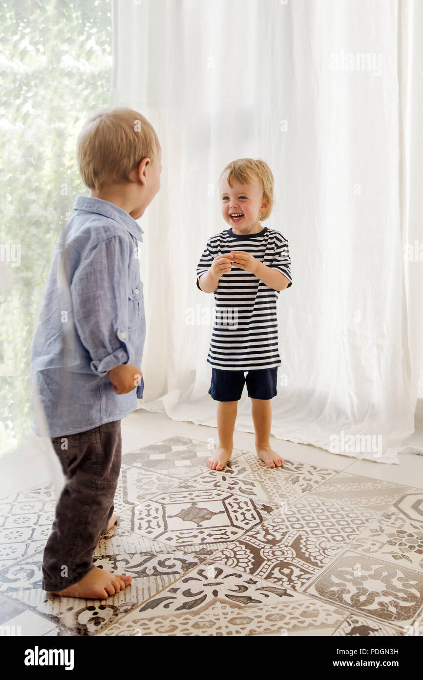 Cheerful little boys at home Stock Photo