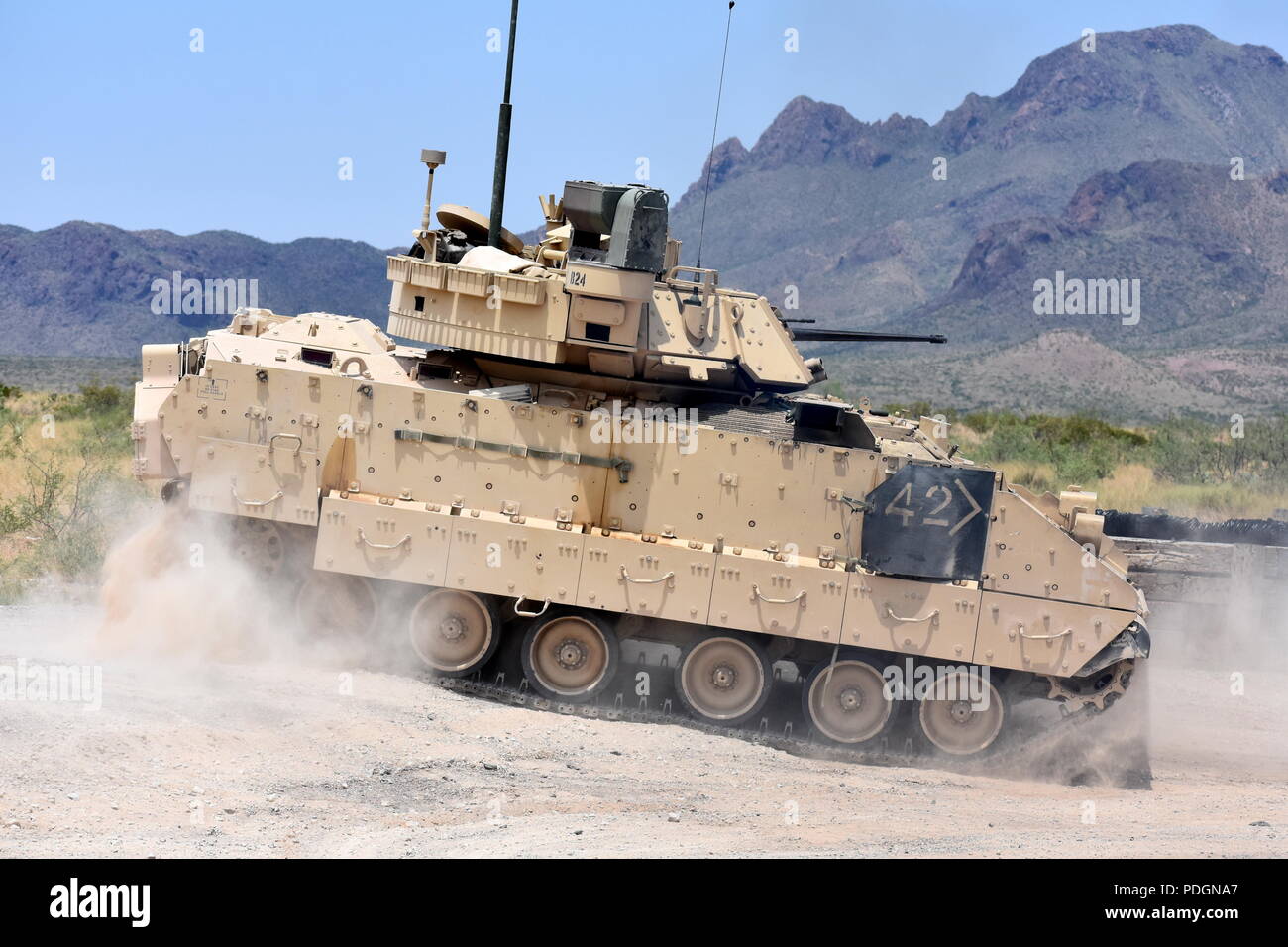 An M2A3 Bradley Fighting Vehicle crew changes position on the range