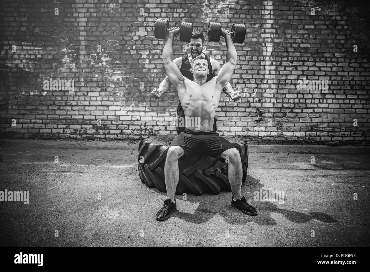 Shoulder muscles exercise Black and White Stock Photos & Images - Alamy