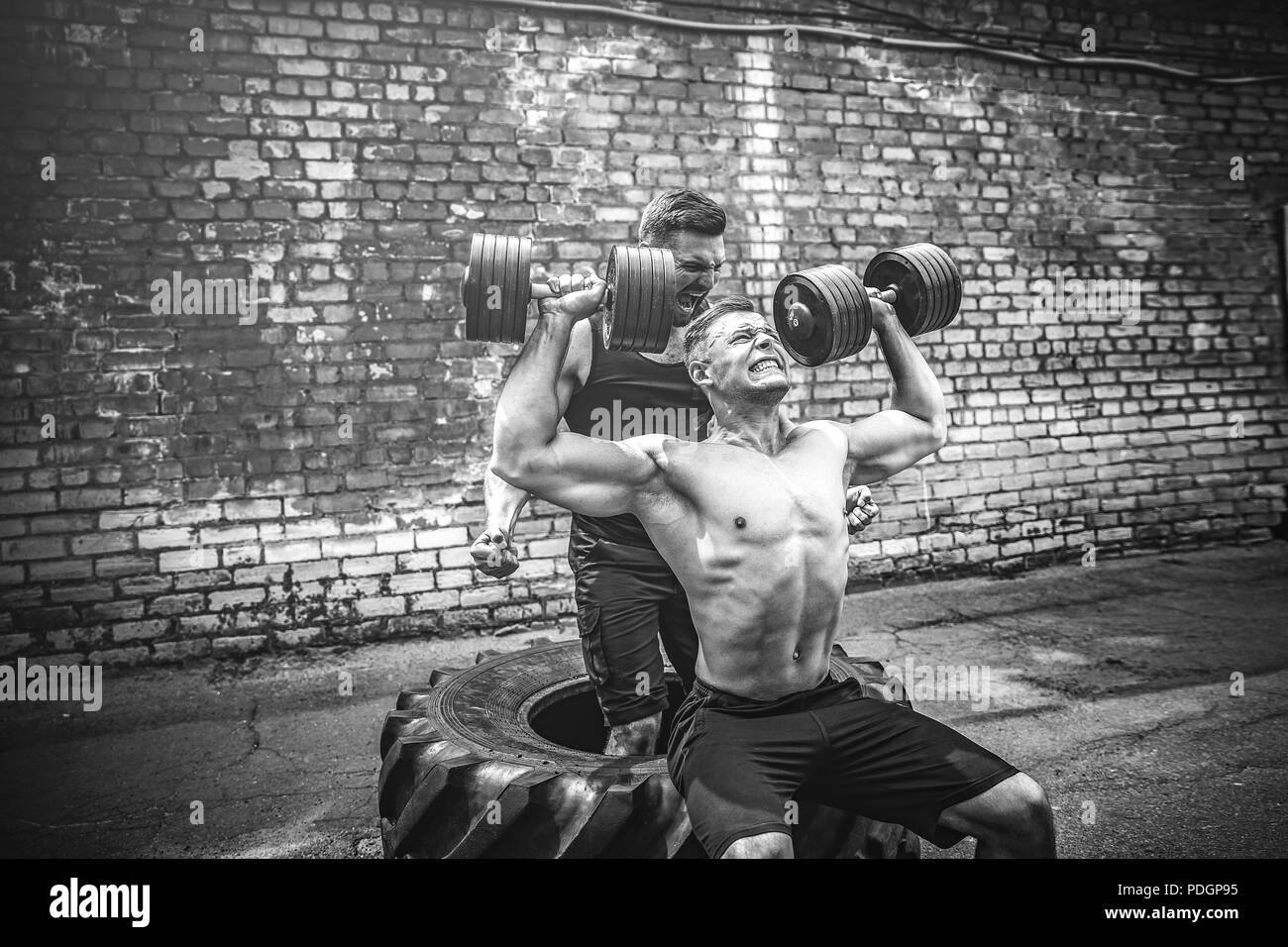 Shoulder muscles exercise Black and White Stock Photos & Images - Alamy