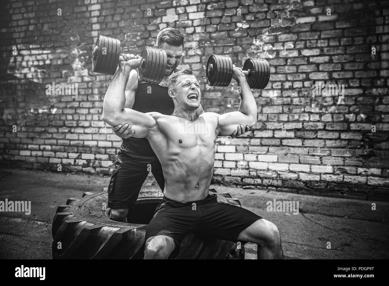 Shoulder muscles exercise Black and White Stock Photos & Images - Alamy