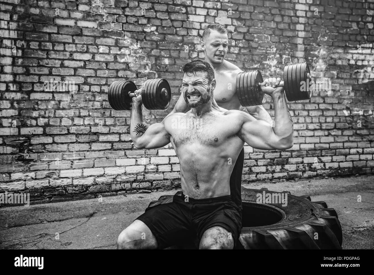 Shoulder muscles exercise Black and White Stock Photos & Images - Alamy