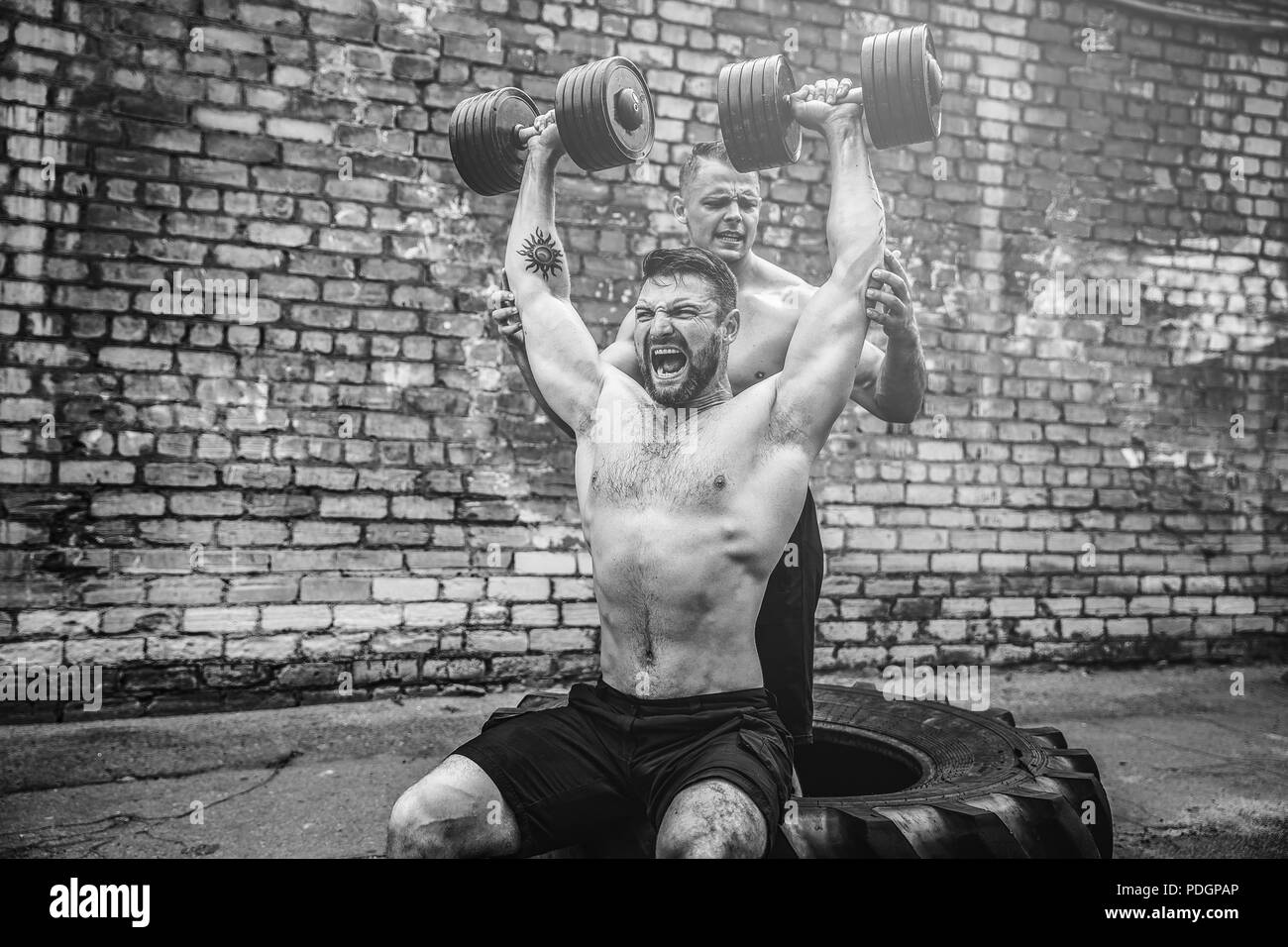Shoulder muscles exercise Black and White Stock Photos & Images - Alamy