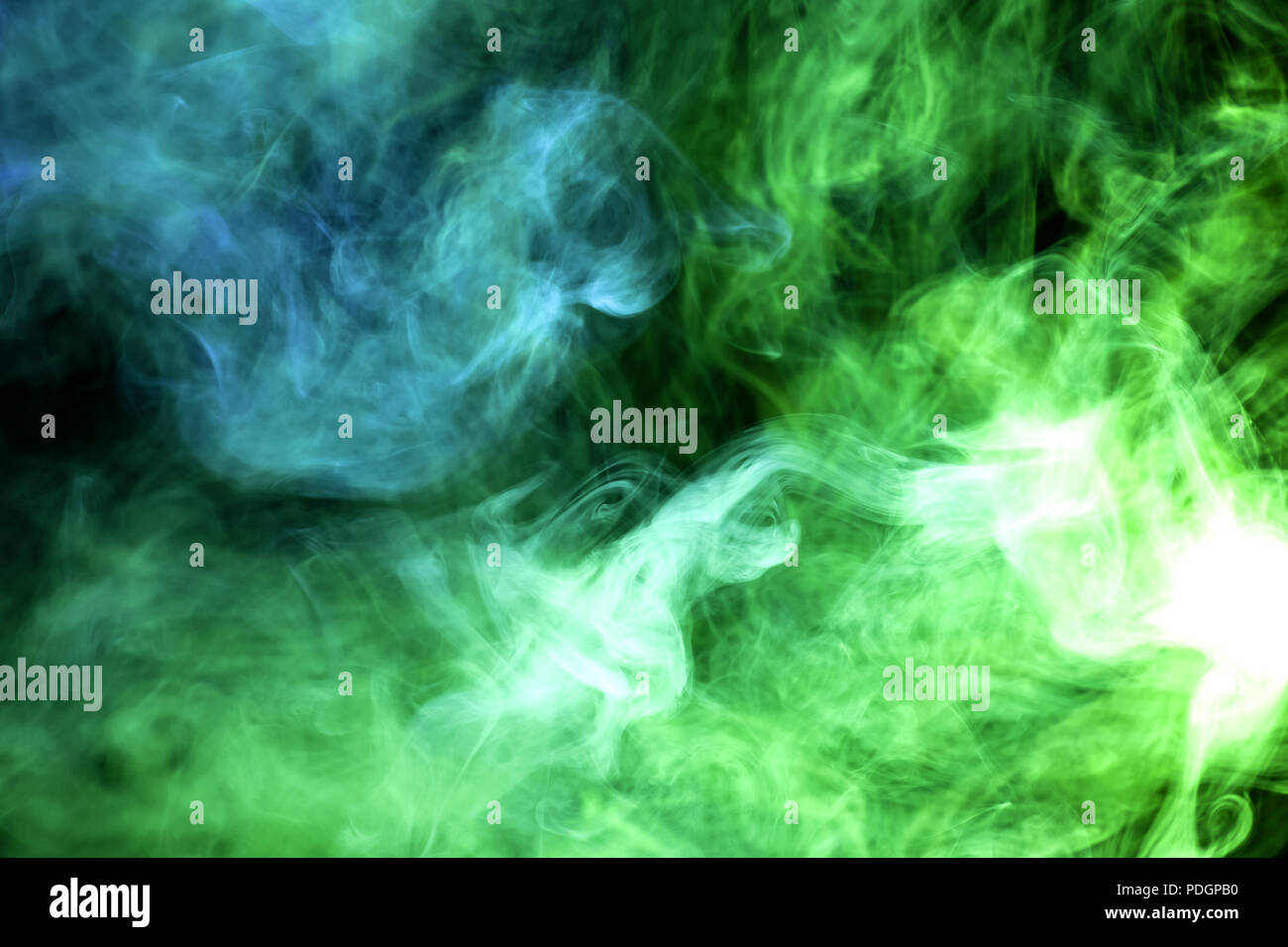 Green and blue smoke on black background Stock Photo - Alamy