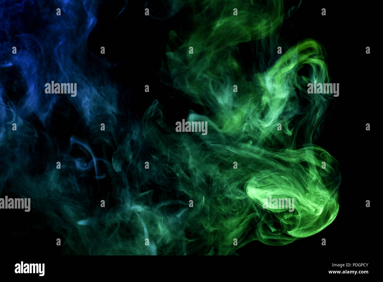 Green and blue smoke on black background Stock Photo - Alamy