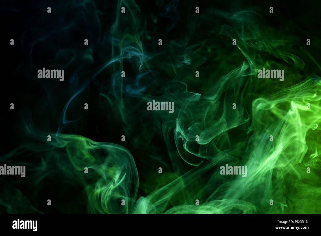 Cloud of blue and green smoke on a black isolated background ...