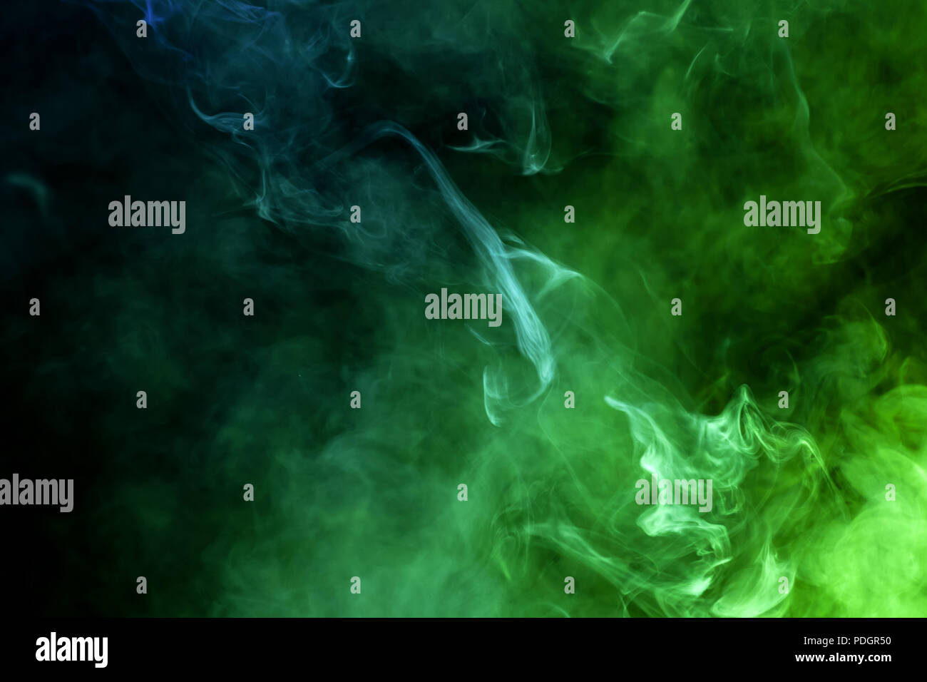 Cloud of blue and green smoke on a black isolated background ...