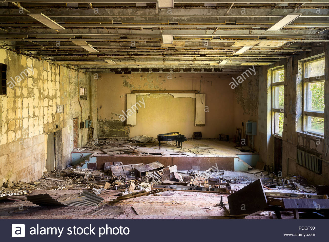 Decaying interior of an abandoned building with peeling paint and ...